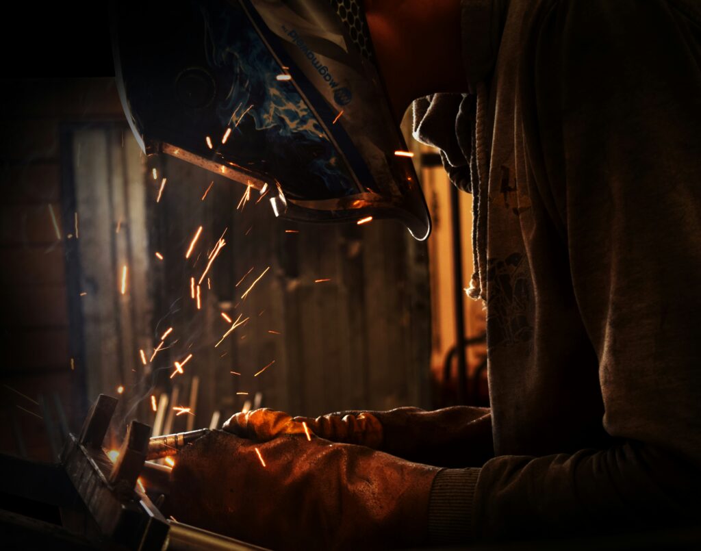 Welder with a welding mask on